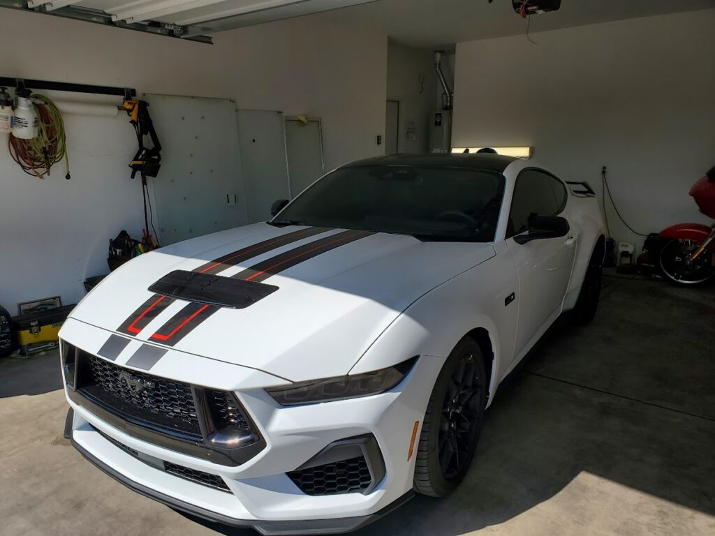 White Car with Stripes in a Garage